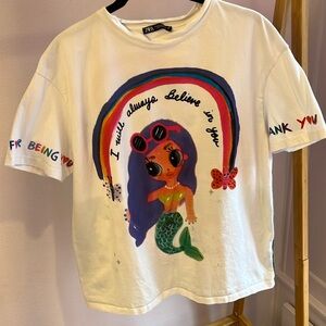 Zara T shirt.Size M.Color is white but with multiple other colors.